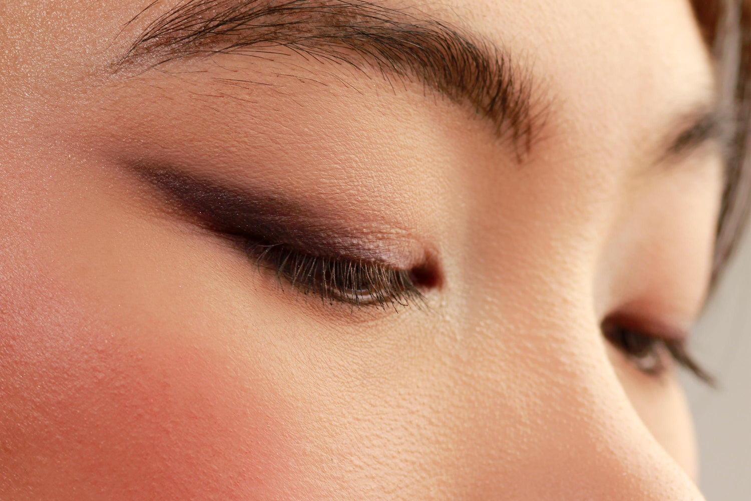 Close-up of an eye wearing a full DUSK eyeshadow look, with all shades of the cool neutral nude talc free vegan Halal palette