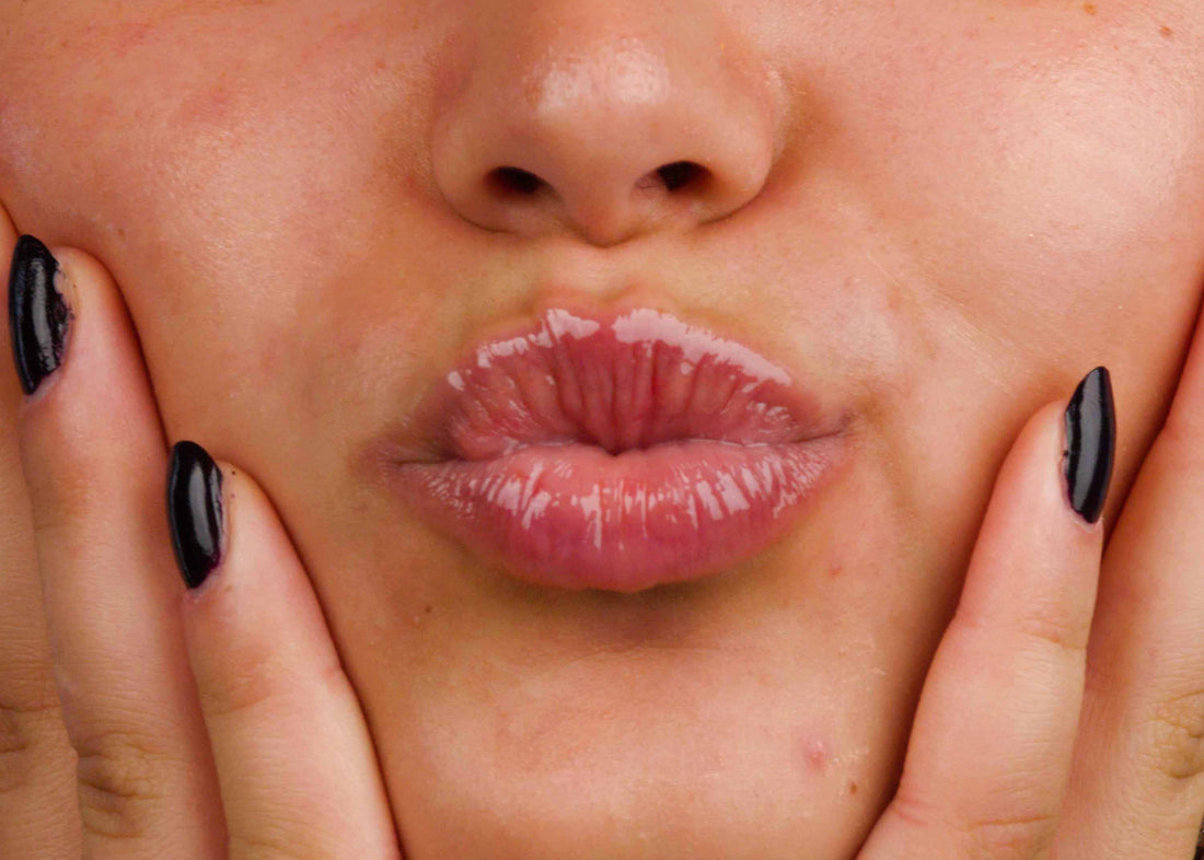 Close-up for a woman's lips wearing Lebubè natural, glossy and hydrating lip oil and lip balm for dry lips in Lemon Chiffon