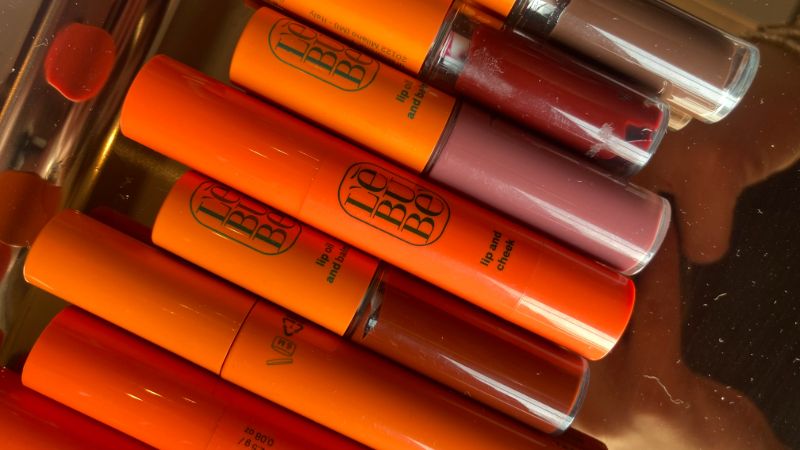 Collection of Lebubè natural Halal and vegan hybrid cosmetics, with a focus on lipsticks, blushes and lip oils, on a tray