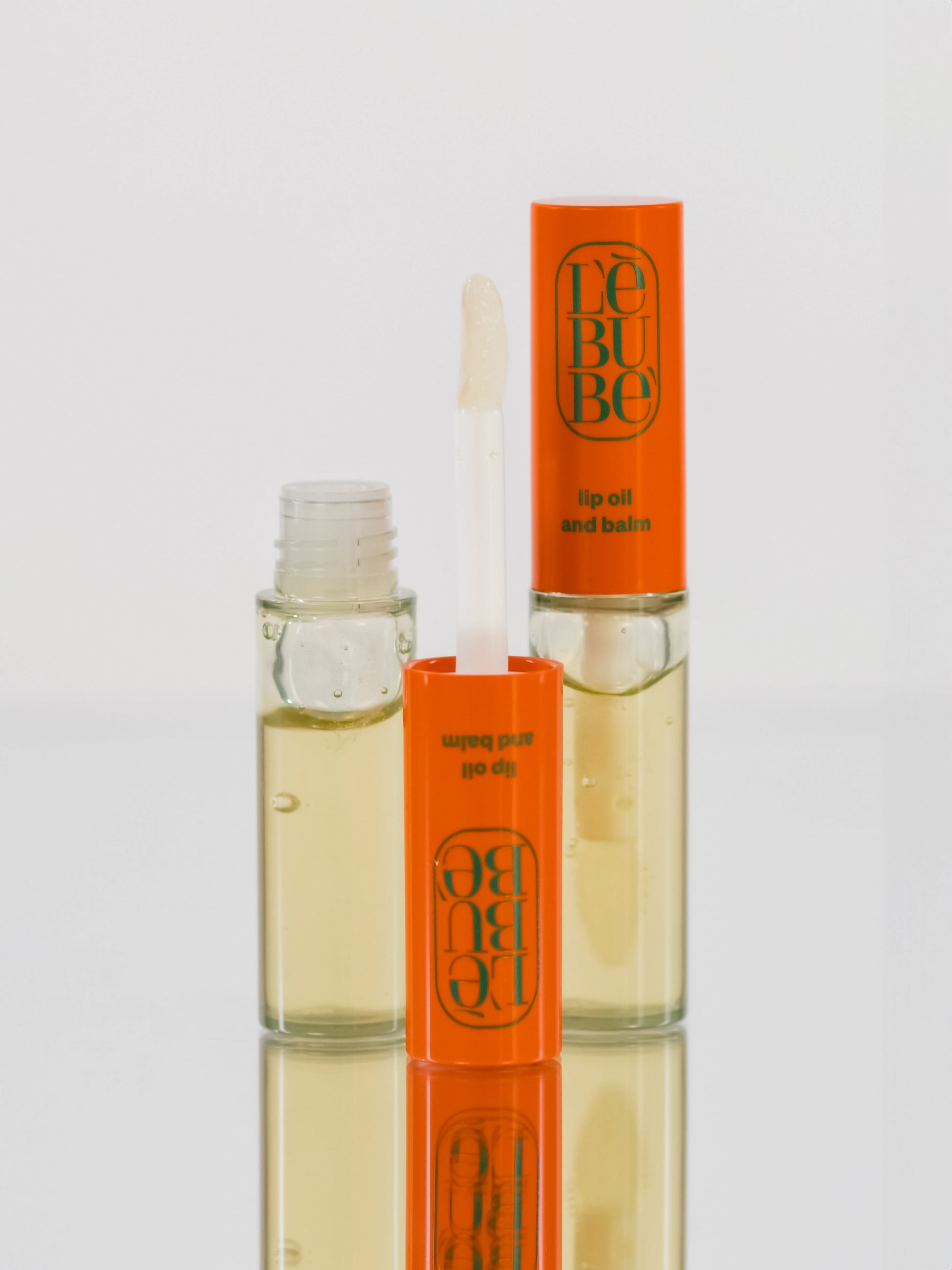 Lebubè Lip Oil and Balm: zoomed-in front view of Lemon Chiffon shade. Hydrating vegan lip treatment and balm.