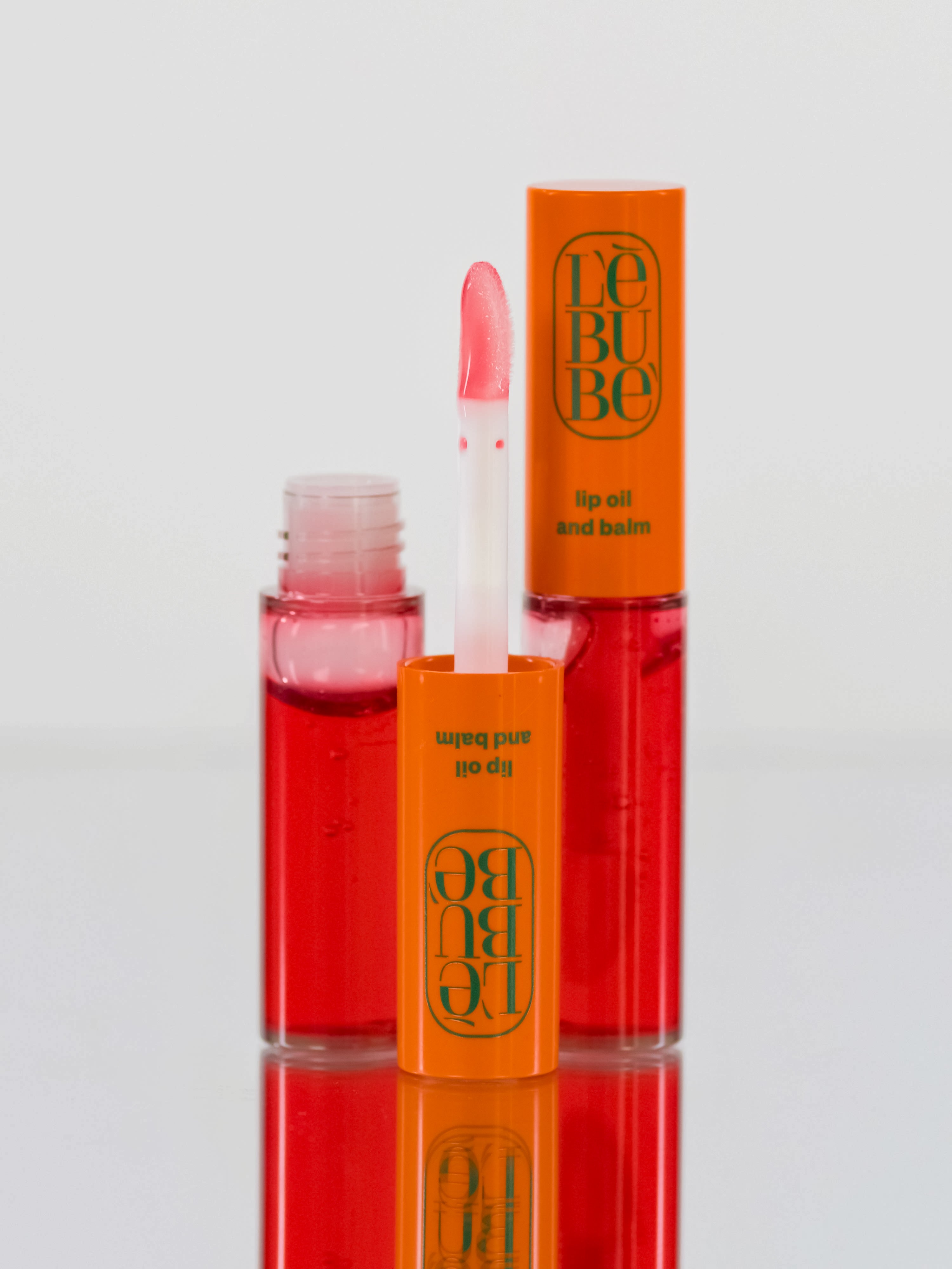 Lebubè Lip Oil and Balm: zoomed-in front view of Orchid Pink shade. Hydrating, nourishing vegan lip balm.