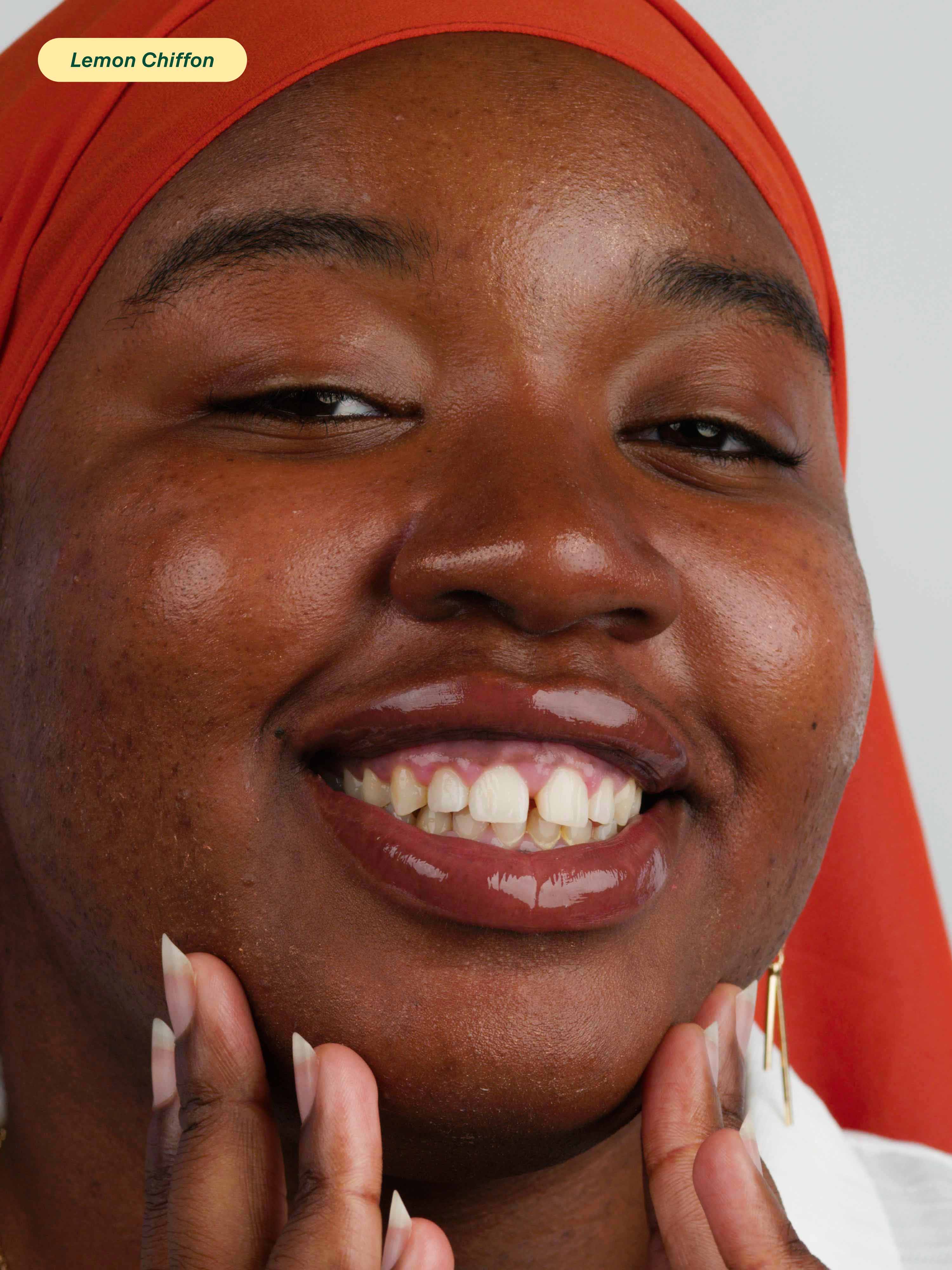 Woman wearing Lebubè Lip Oil and Balm in Lemon Chiffon, a natural 2 in 1 nourishing lip oil and hydrating balm for lips