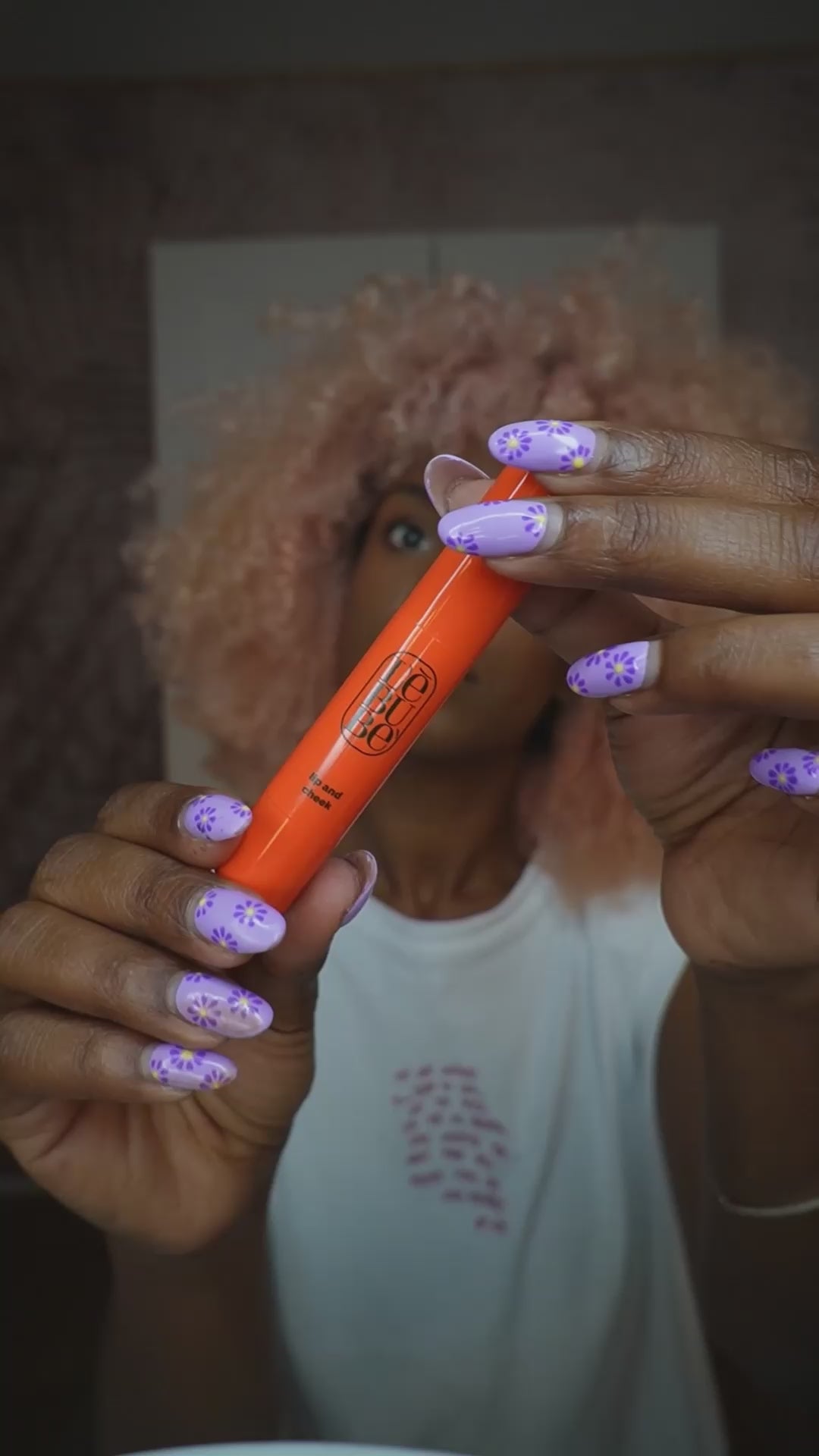 Load video: Woman applying Lip and Cheek in Rubia Rose, a makeup-with-benefits multifunctional crayon that works as lipstick and blush