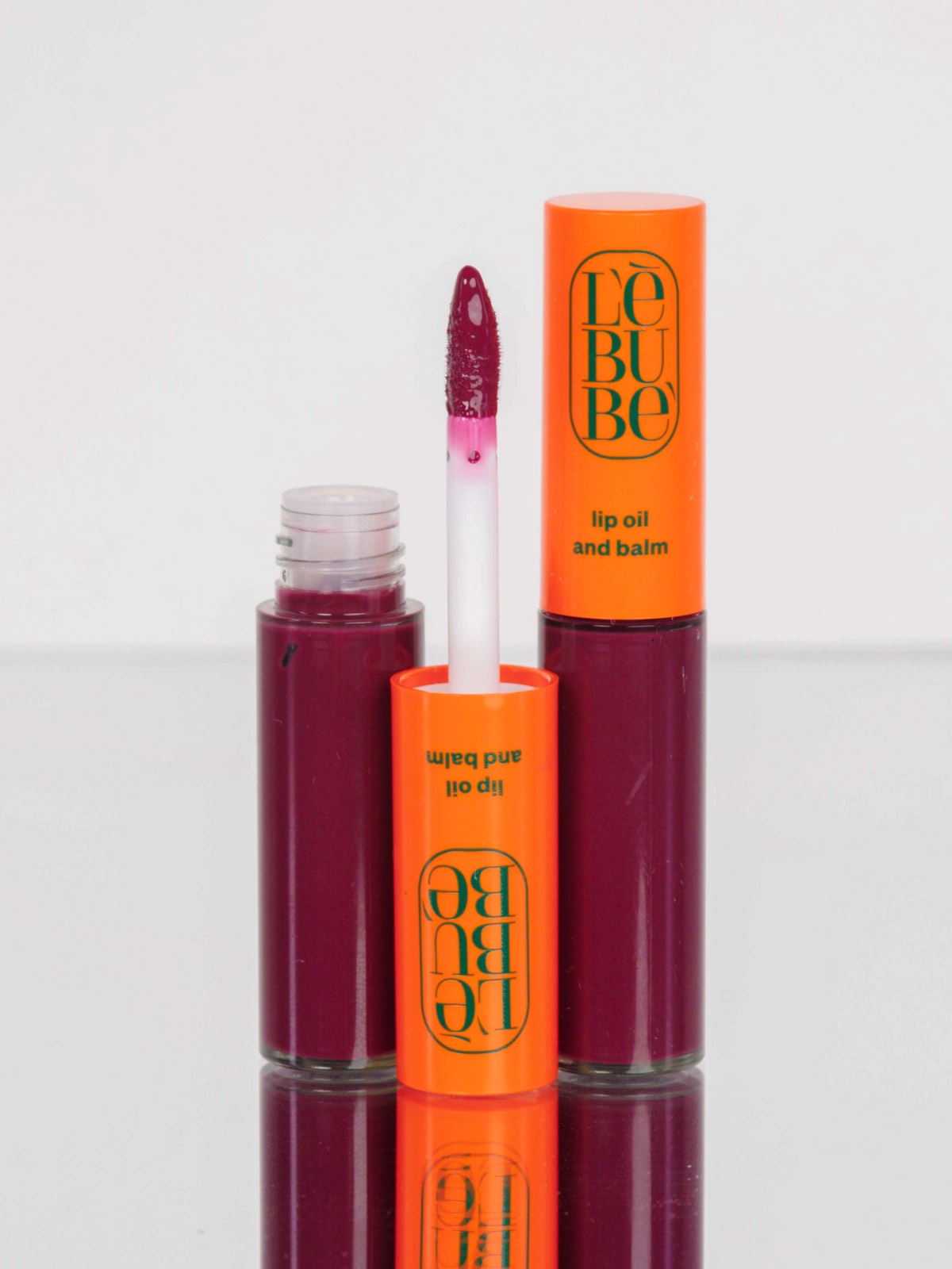 Lebubè Tinted Lip Oil and Balm: zoomed-in front view of Wine shade. Hydrating tinted lip treatment with hyaluronic acid 