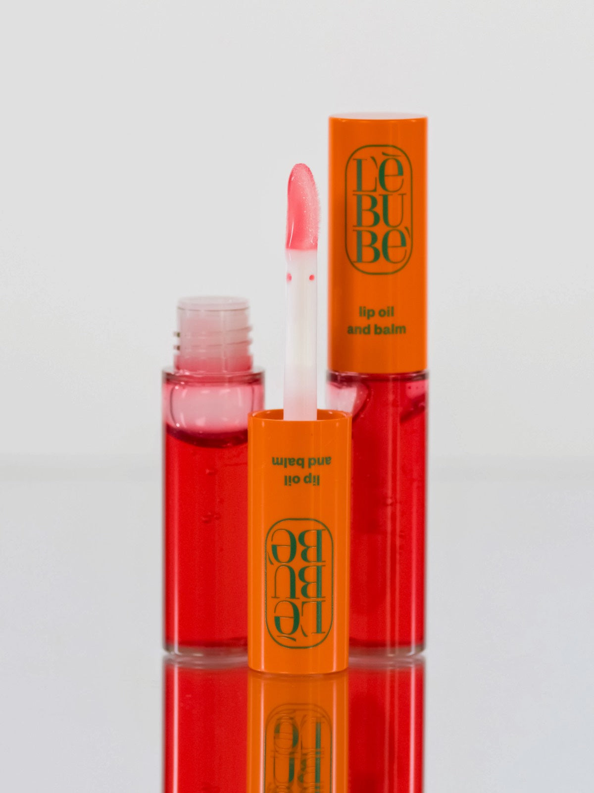 Lebubè Lip Oil and Balm: zoomed-in front view of Orchid Pink shade. Hydrating, nourishing vegan lip balm.