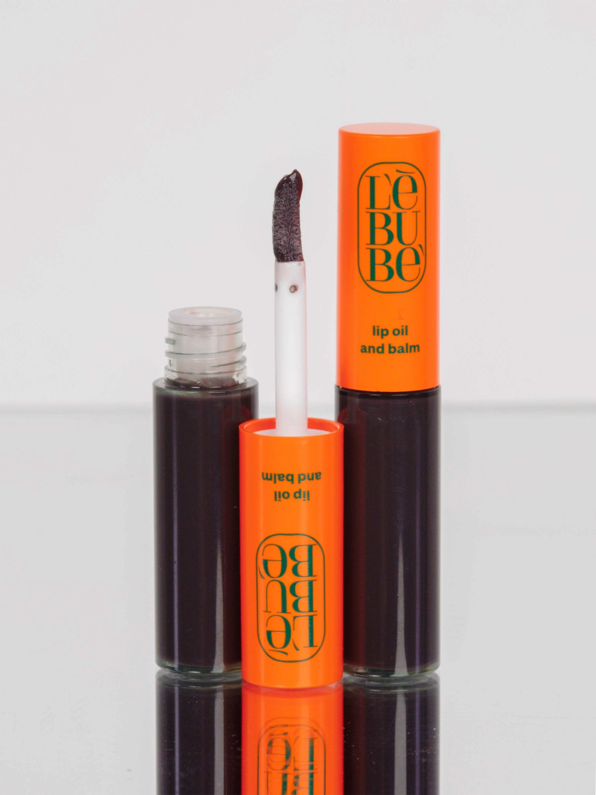 Lebubè Tinted Lip Oil and Balm: zoomed-in front view of Enigma shade. Hydrating grey lip oil for sophisticated cooler lips