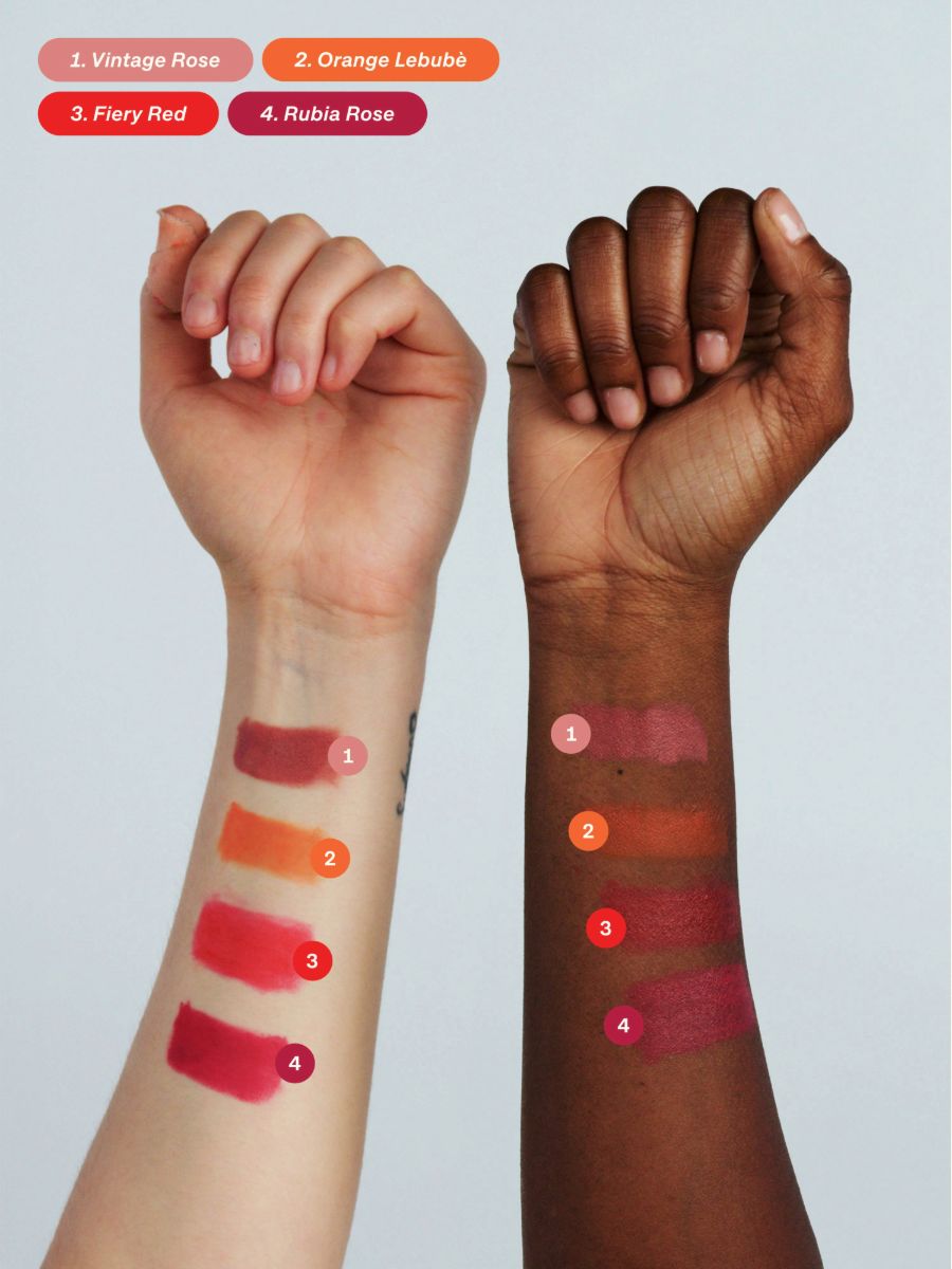 Two arms showing the cream to powder texture and four inclusive shades of Lebubè 2 in 1 natural and vegan lipstick and blush