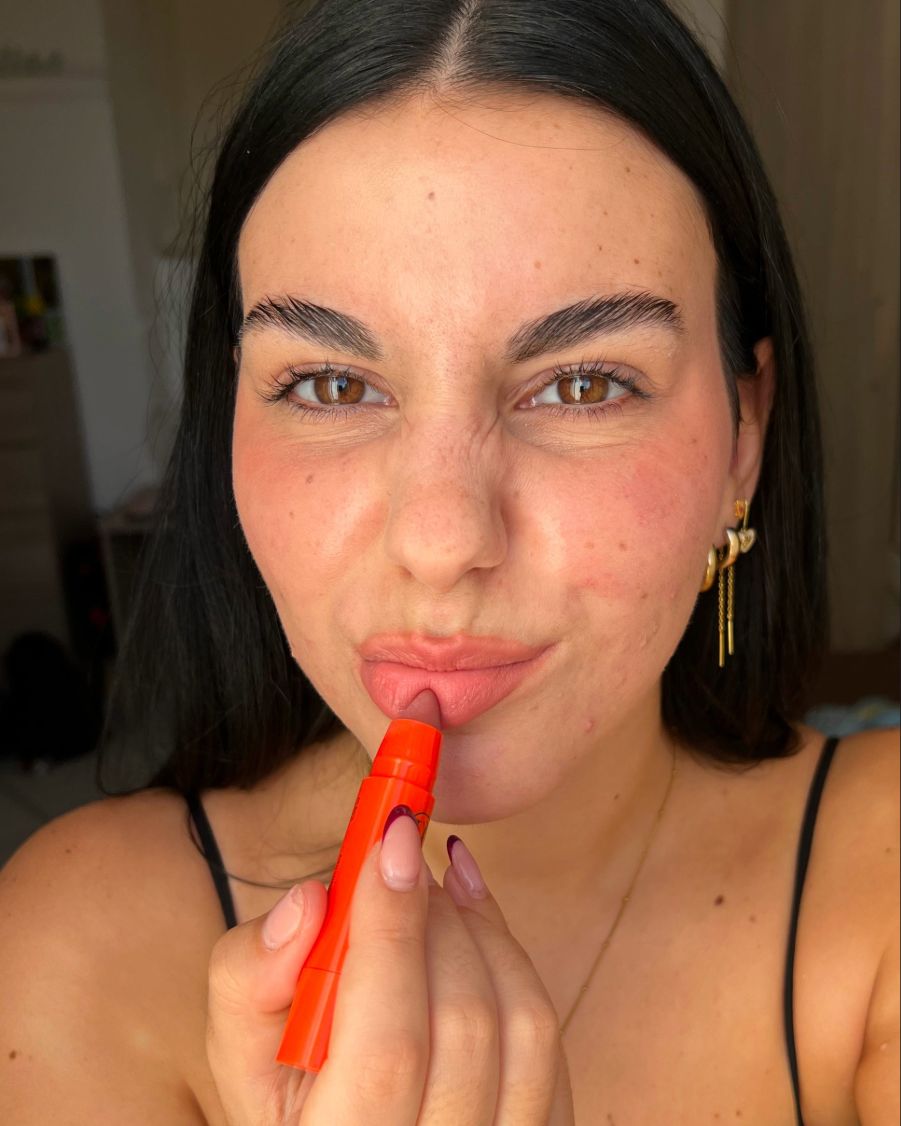 Woman wearing Lebubè Lip and Cheek in Vintage Rose on cheeks and lips, Halal and vegan blush and lipstick for natural look