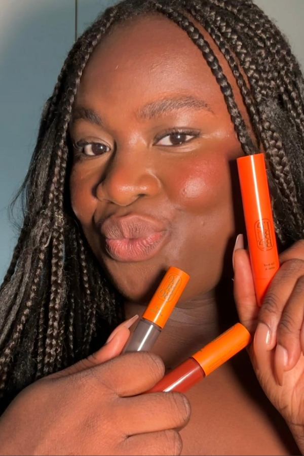 Woman wearing Lebubè Tinted Lip Oil and Balm on Lip and Cheek for dewy, glowy and hydrated lips. From Lebubè hybrid cosmetics