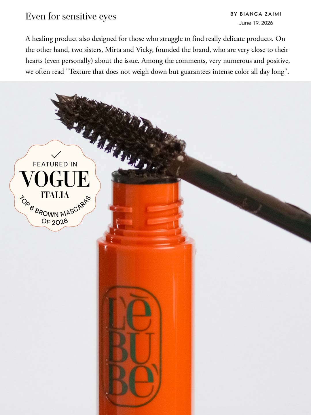 Lebubè plant-based brown mascara for naturally defined lashes. Brush zoomed in, resting on tube. From Lebubè hybrid cosmetics