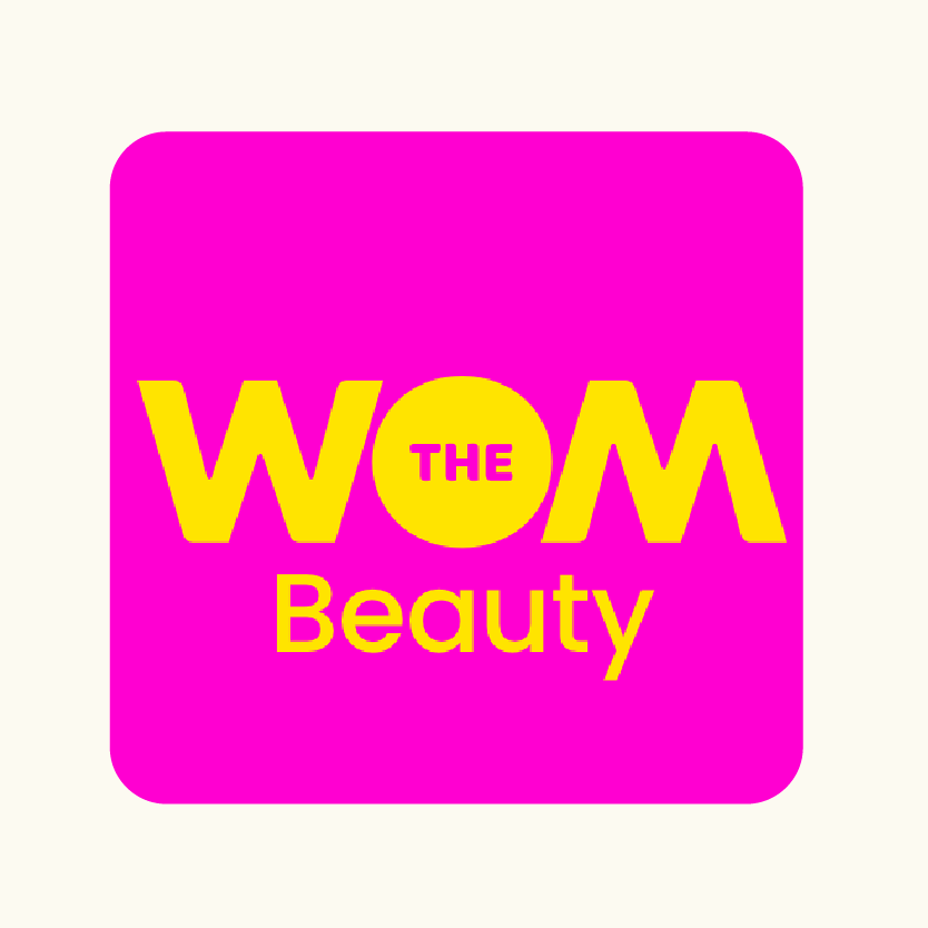 Logo of WOM Beauty, which featured Lebubè vegan, cruelty free and inclusive makeup with skincare benefits in an article