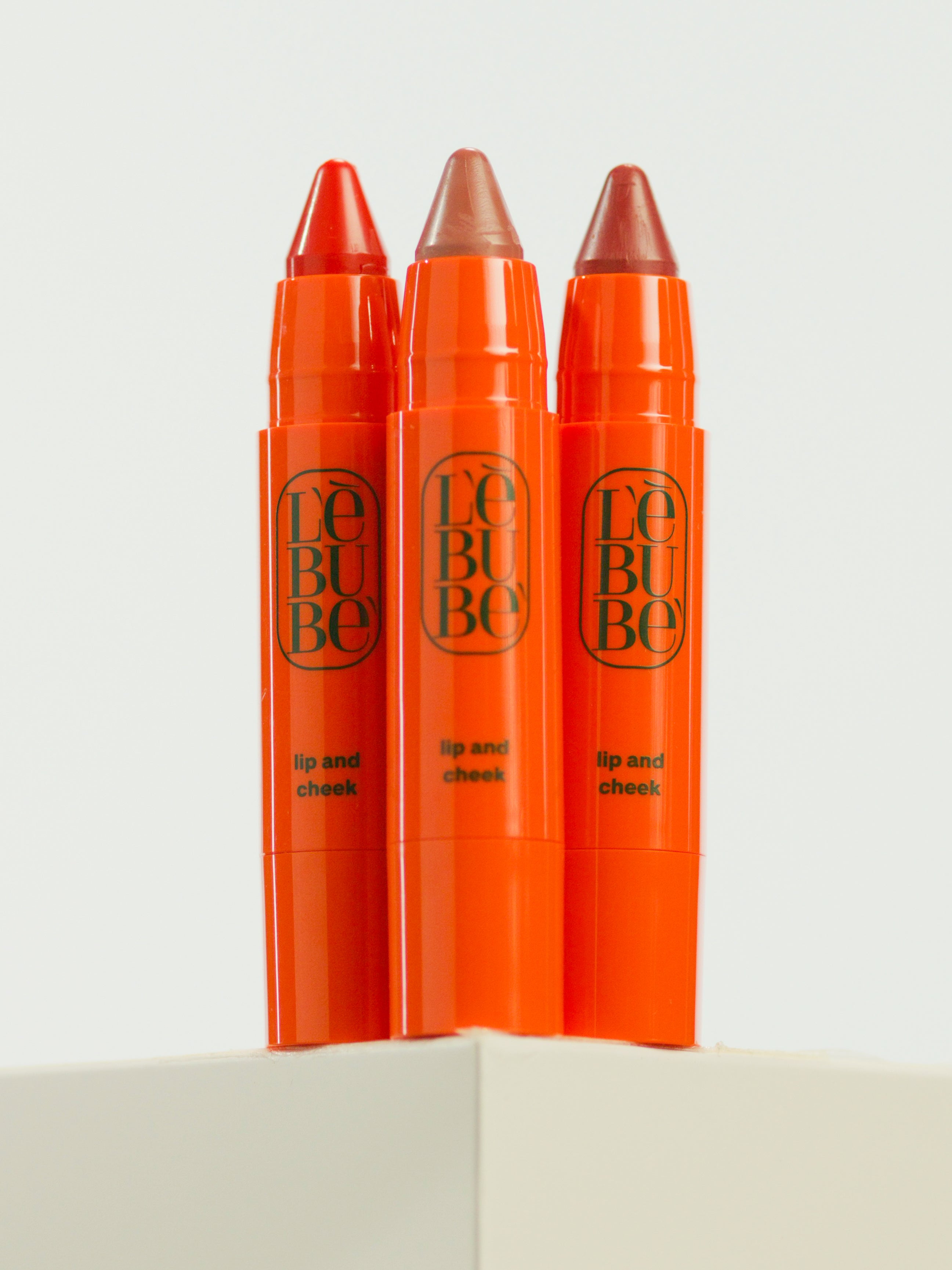 Lebubè Lip and Cheek 2 in 1 blush and lipstick, three inclusive shades, front view. From Lebubè vegan Halal hybrid cosmetics