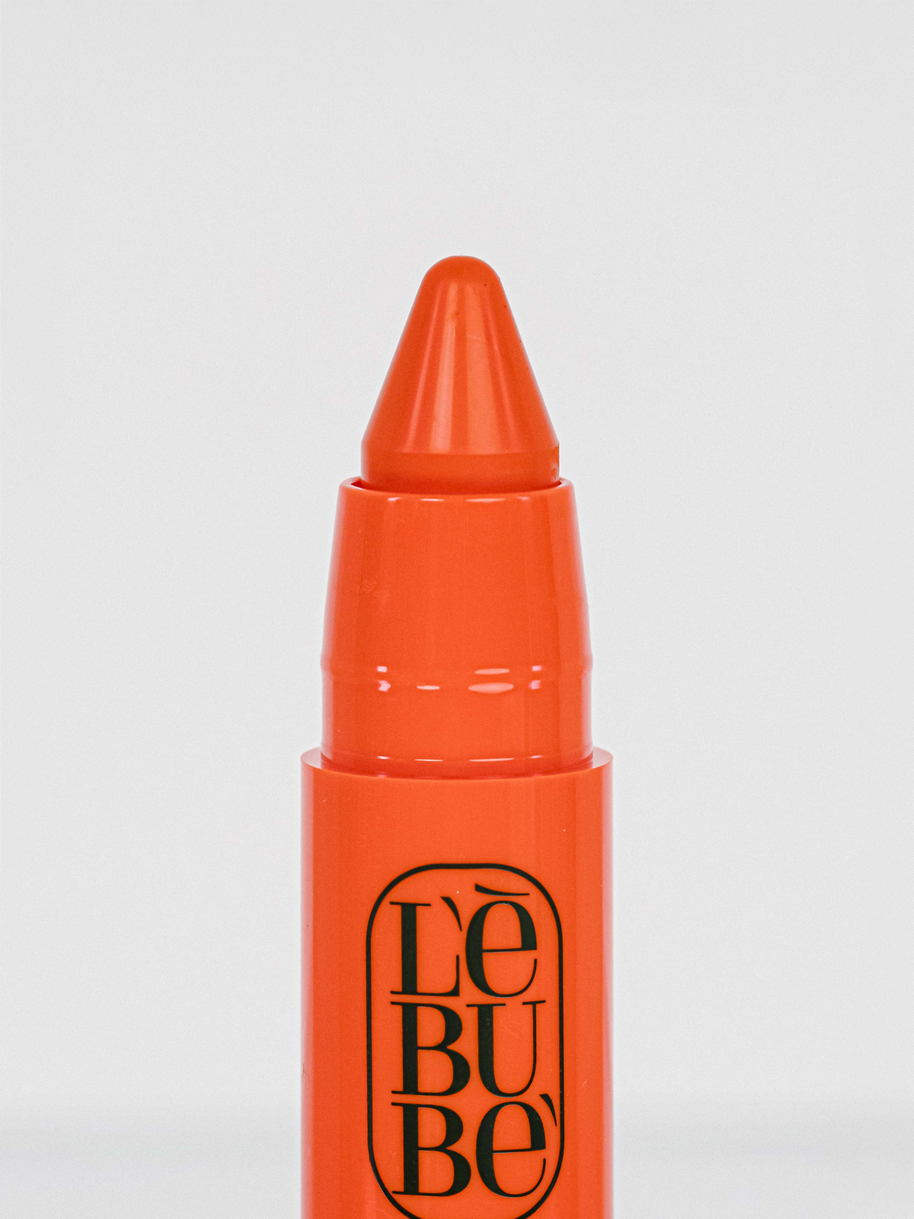 Lebubè Lip and Cheek: zoomed-in front view of Orange Lebub shade. 2 in 1 Halal, vegan and natural blush and lipstick.