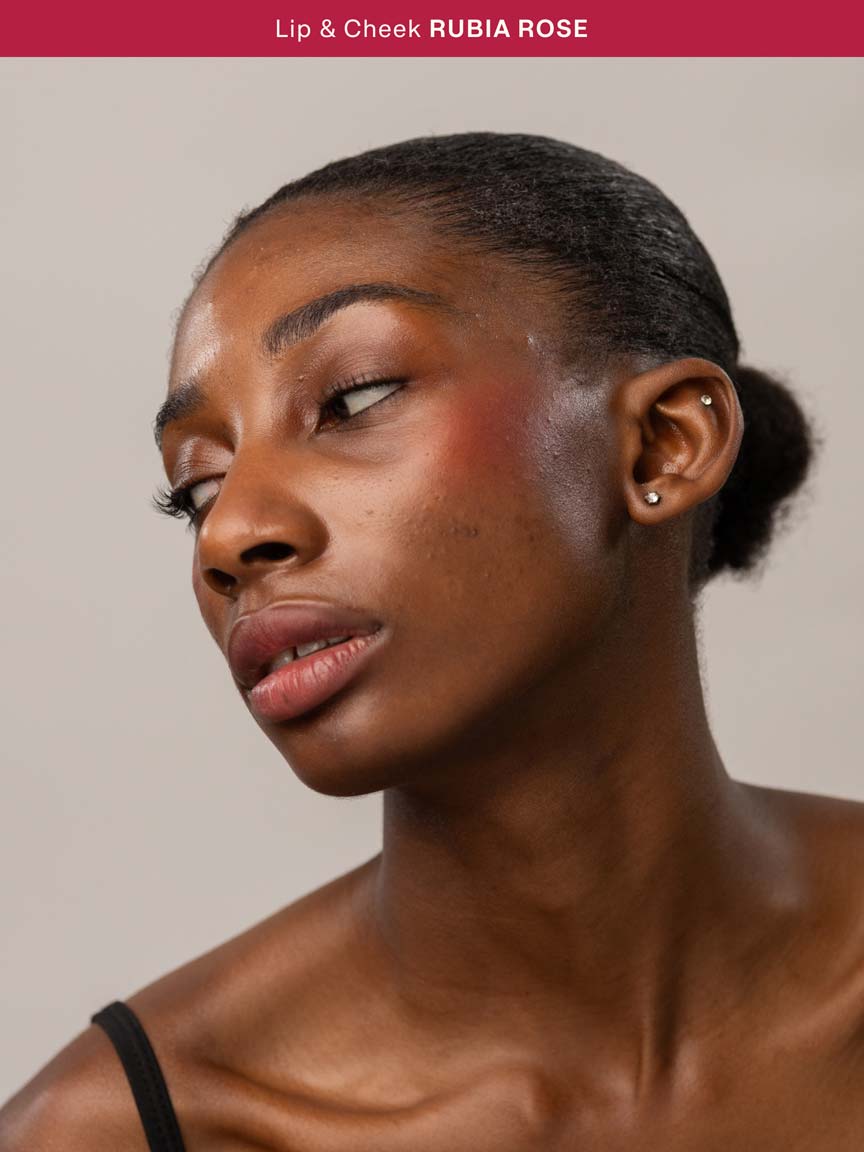 Woman wearing Lebubè Lip and Cheek in Rubia Rose on cheeks and lips for a natural look. From Lebubè natural hybrid cosmetics.