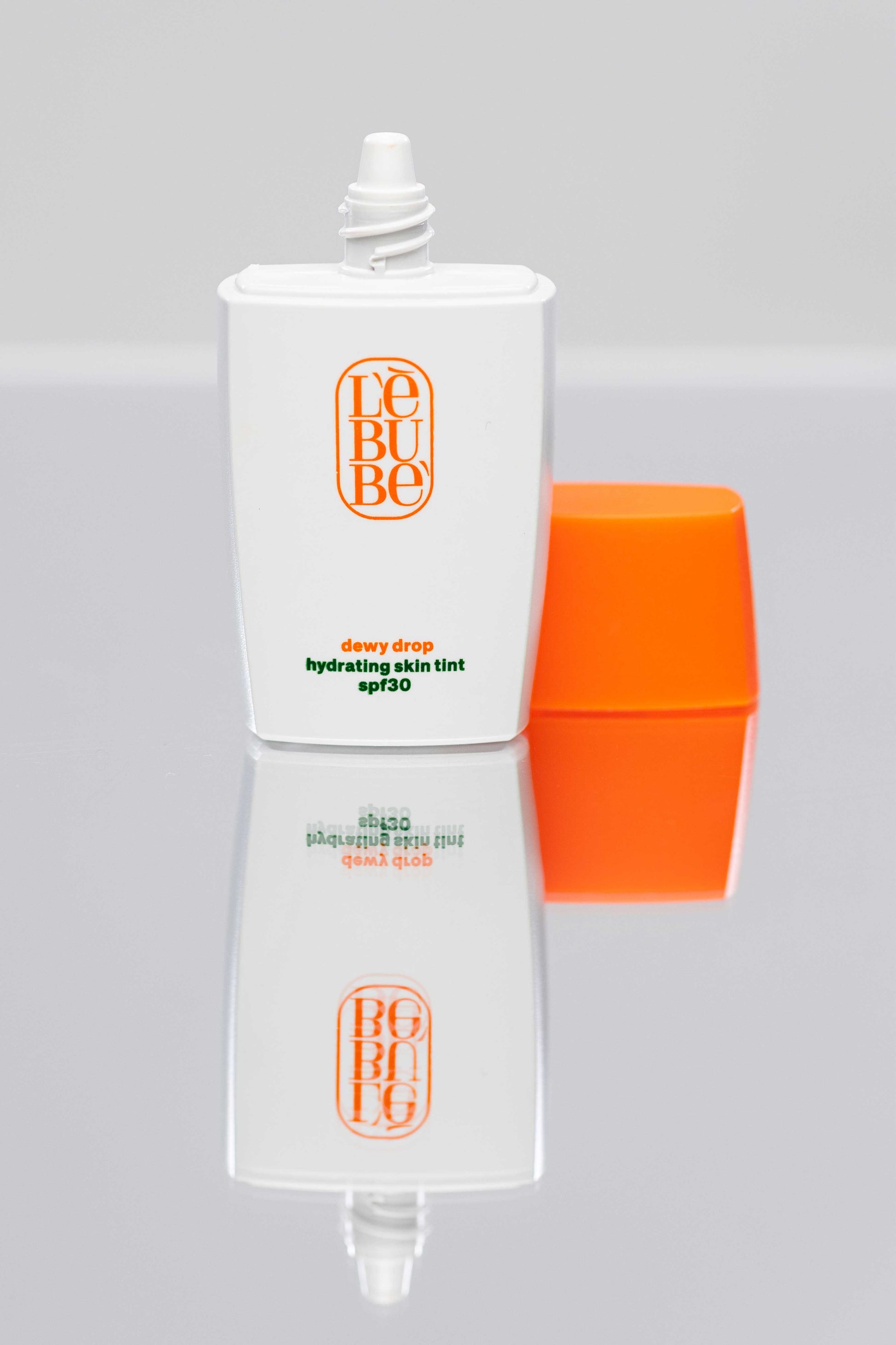 Dewy Drop Hydrating Skin Tint SPF30 open cap, Halal vegan tinted sunscreen and moisturizer with lightweight hydrating formula