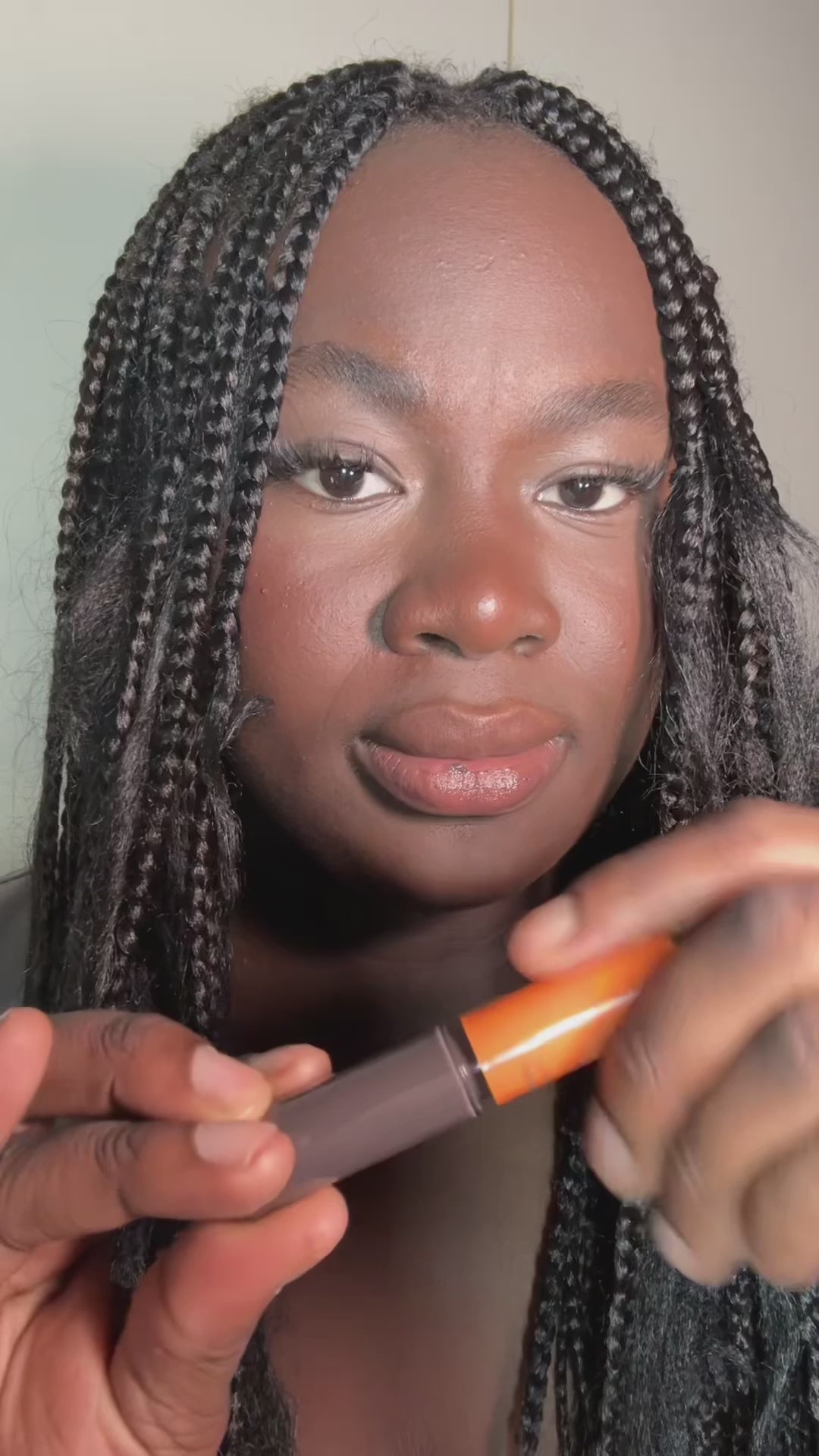 Load video: Woman applying the grey lip oil for cooler lips. A vegan, natural lip oil with skincare actives for nourished and glossy lips