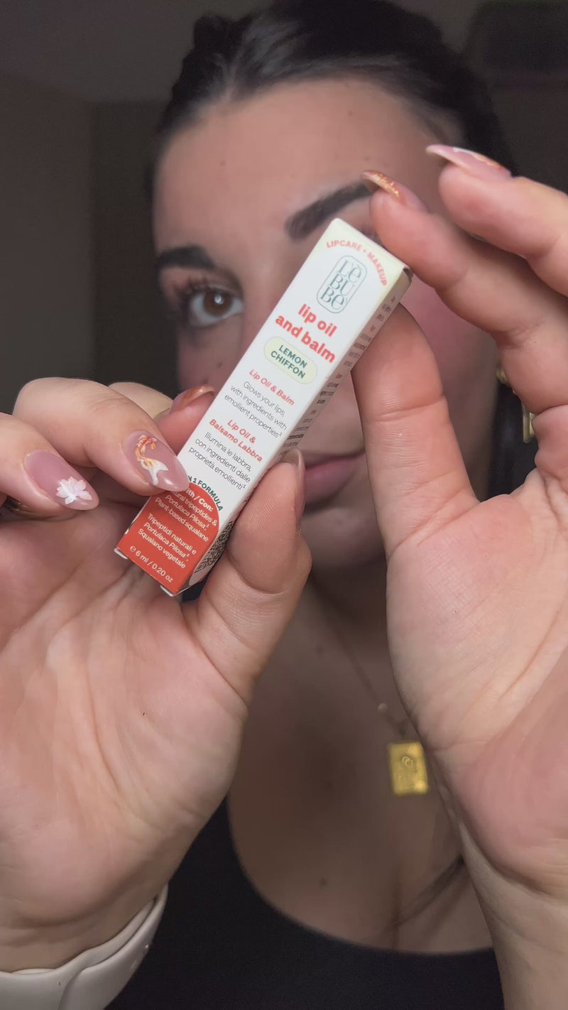 Woman applying Lebubè hydrating peptide-based lip treatment with a glossy finish. From Lebubè skincare-infused makeup