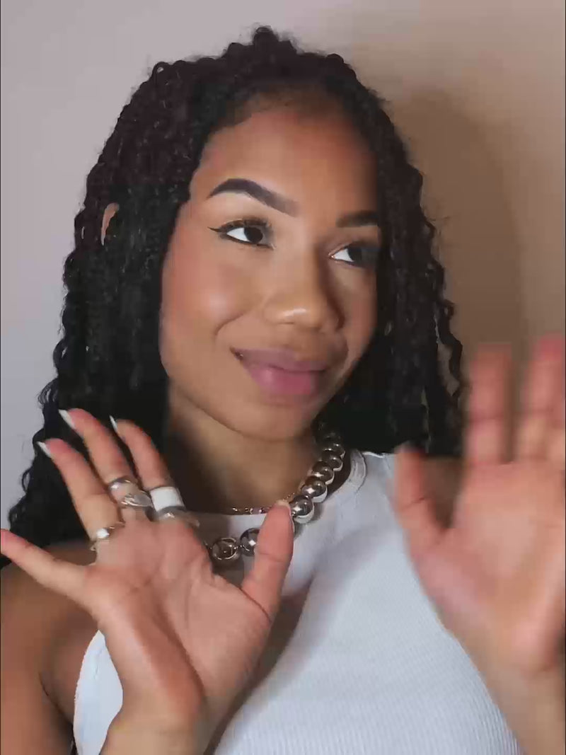 Woman applying the 2 in 1 Lebubè Lip and Cheek in Vintage Rose: natural and vegan blush on her cheeks and stick on her lips.
